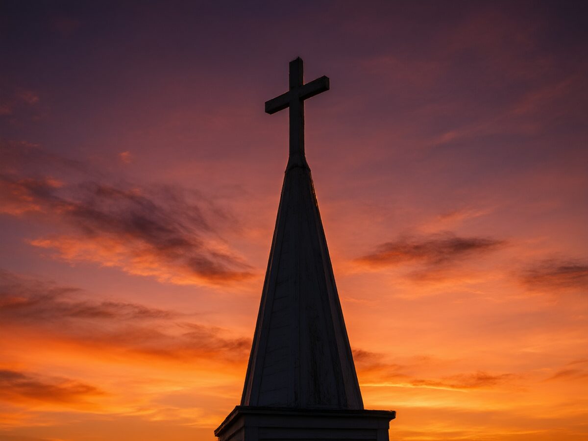 A church steeple at sunset